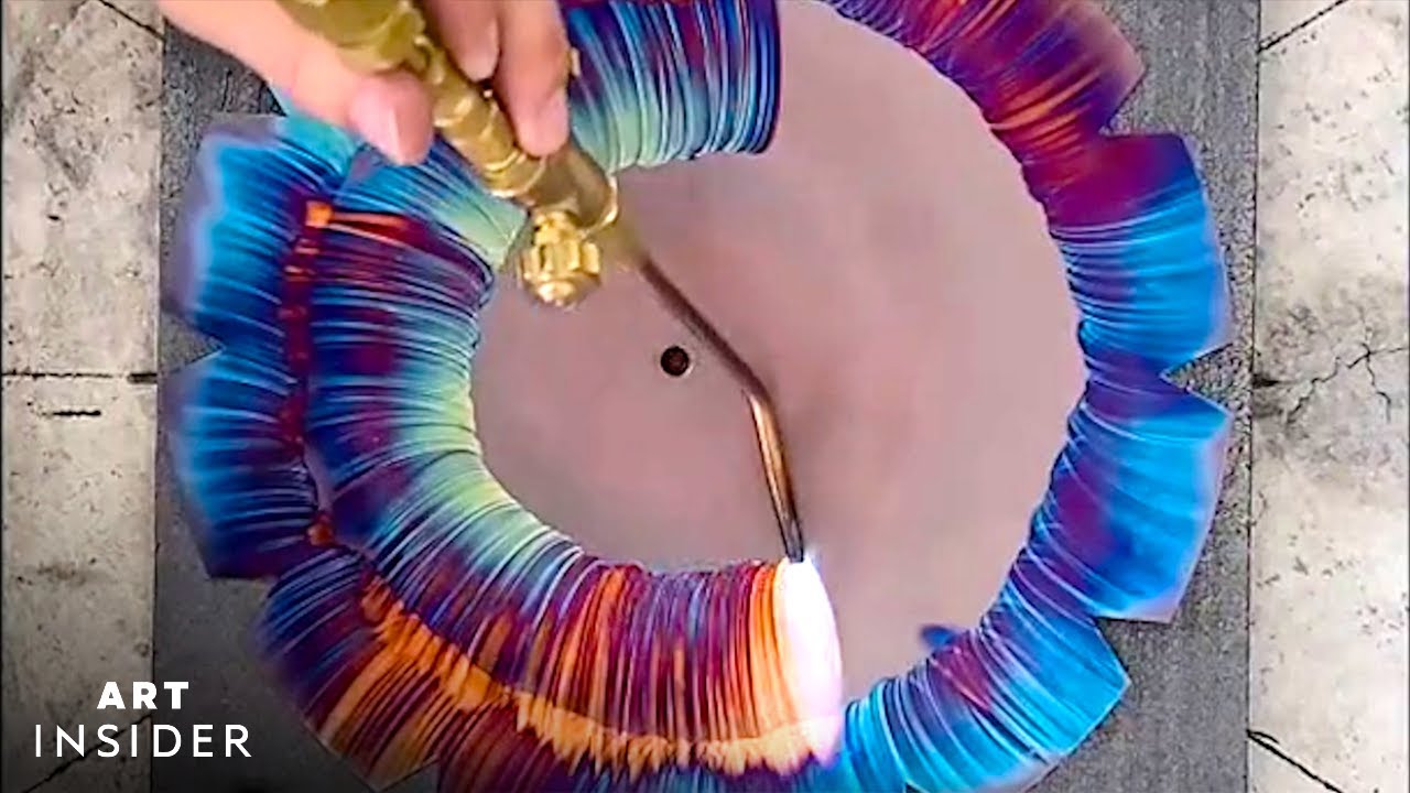 Artist Torches Colorful Designs On Copper Clocks